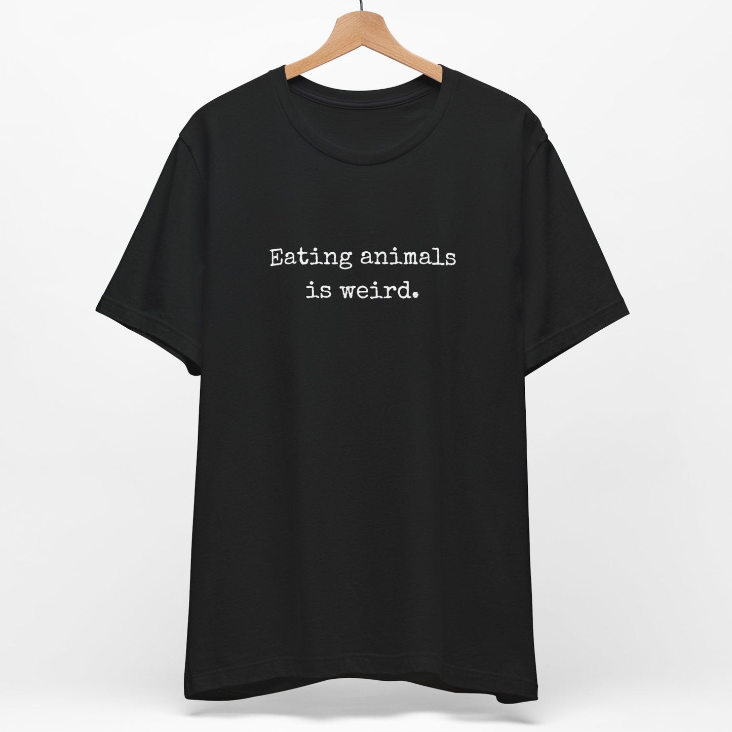 Black minimalist vegan t shirt saying Eating Animals Is Weird.