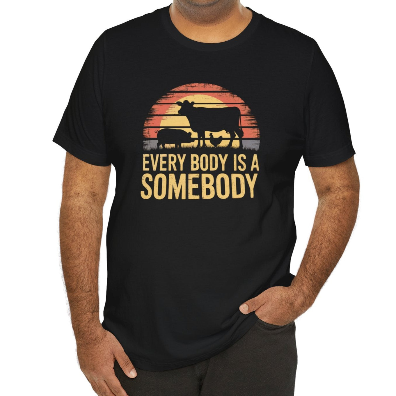 Black vegan t shirt with silhouettes of farm animals against a vintage sunset and the slogan Everybody Is A Somebody