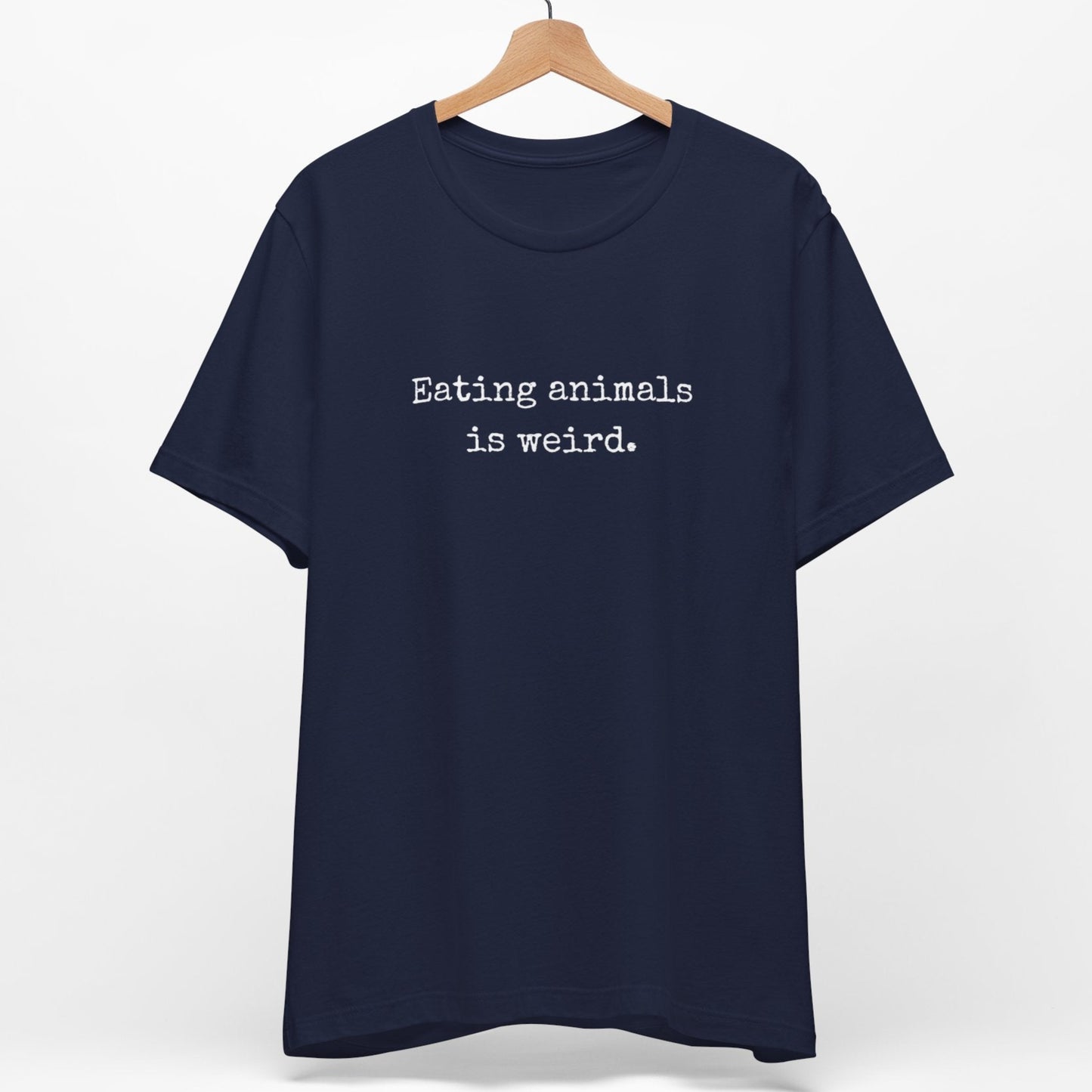 Navy blue vegan tee with the minimalist slogan Eating Animals Is Weird.