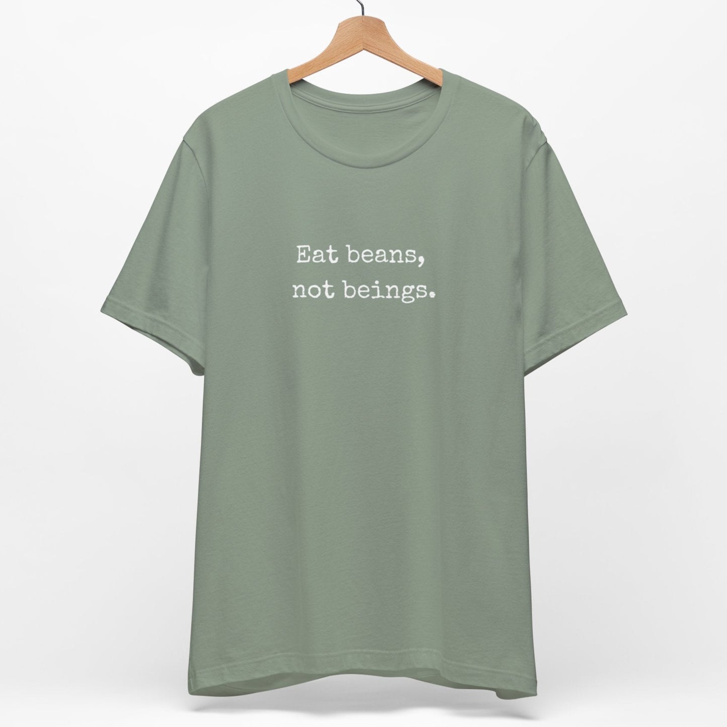 Sage green minimalist vegan t shirt with the slogan Eat Beans Not Beings.