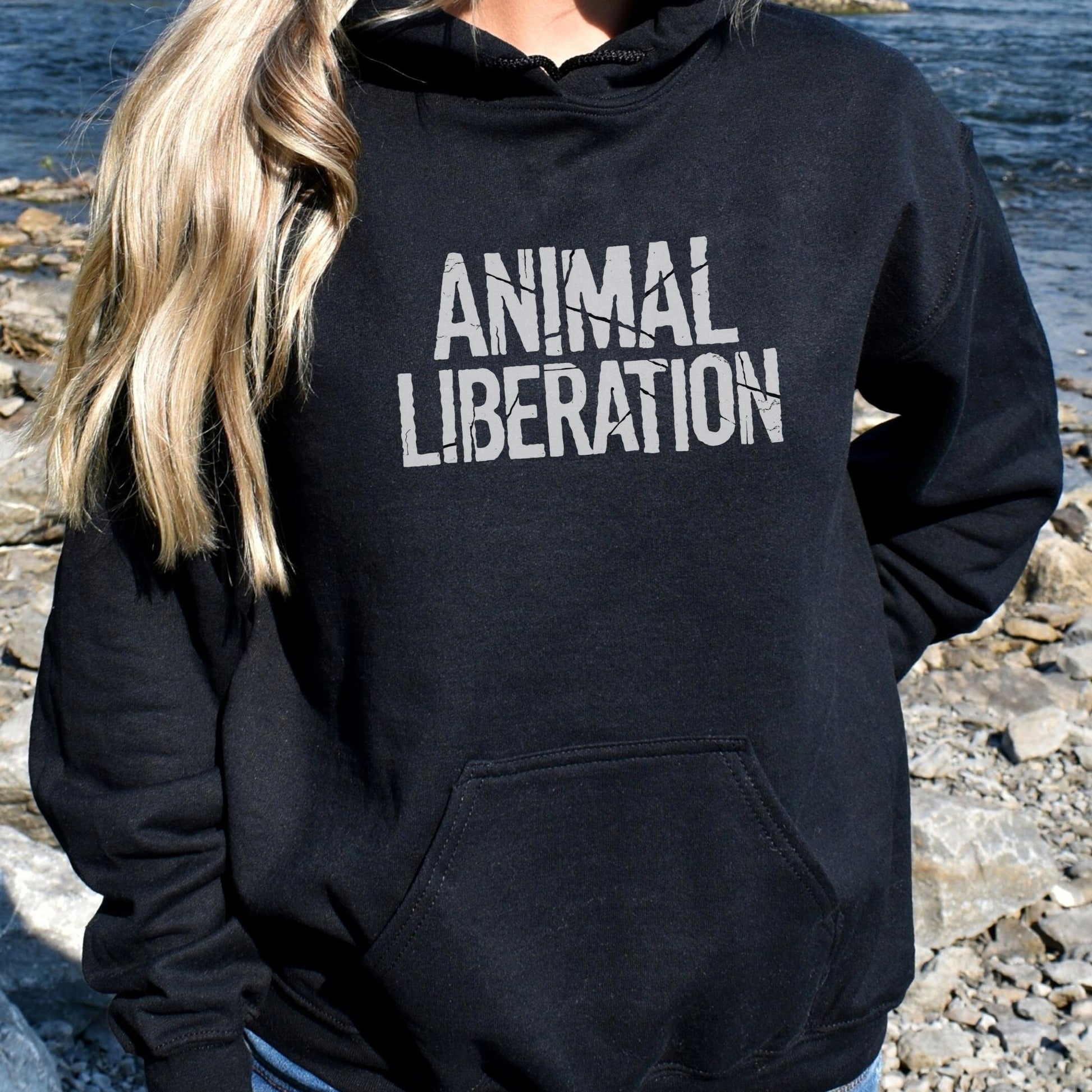 Black vegan animal rights hoodie with a distressed graphic saying 'animal liberation'