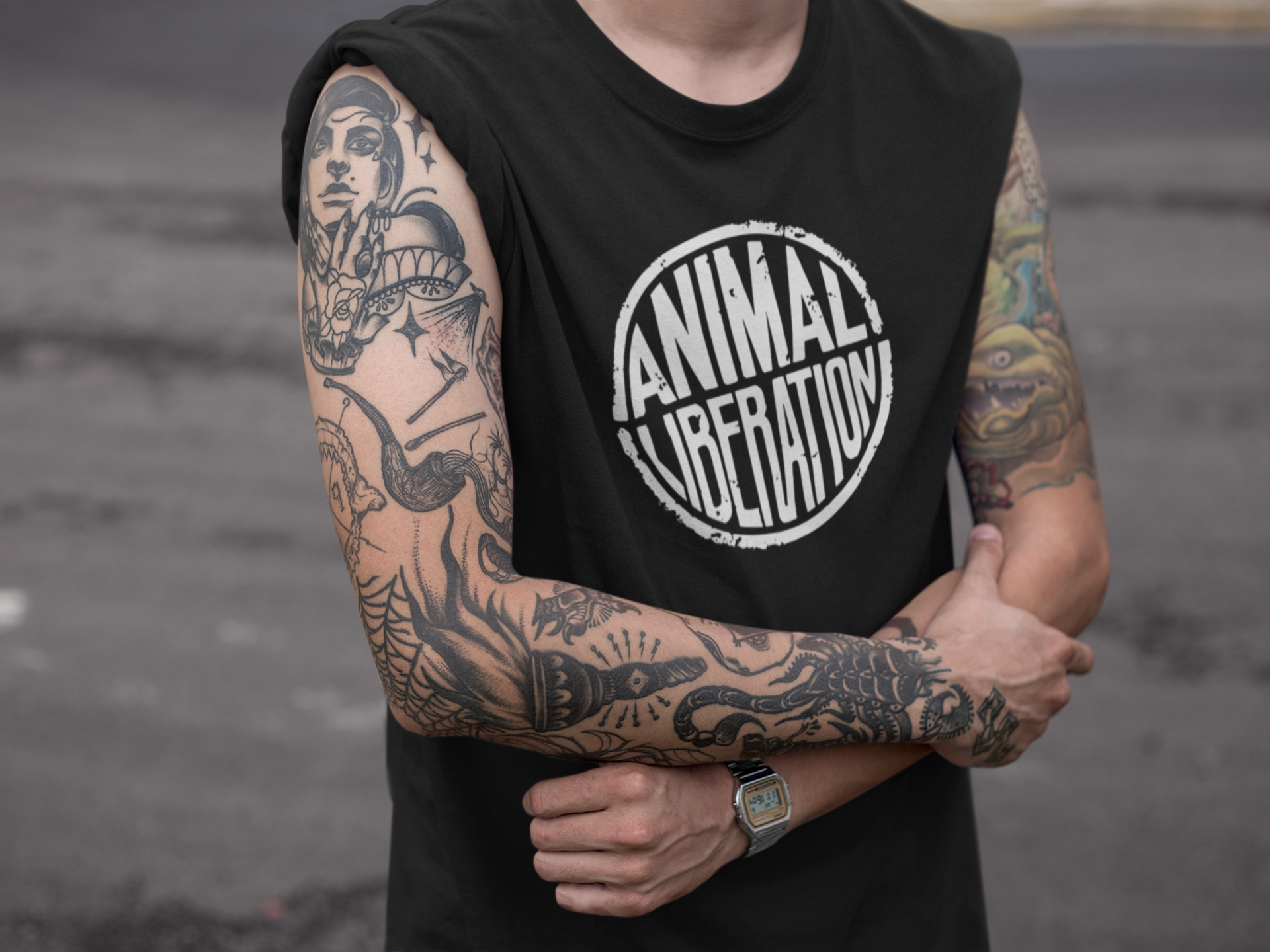Man wearing a black animal rights t-shirt with the slogan Animal Liberation.