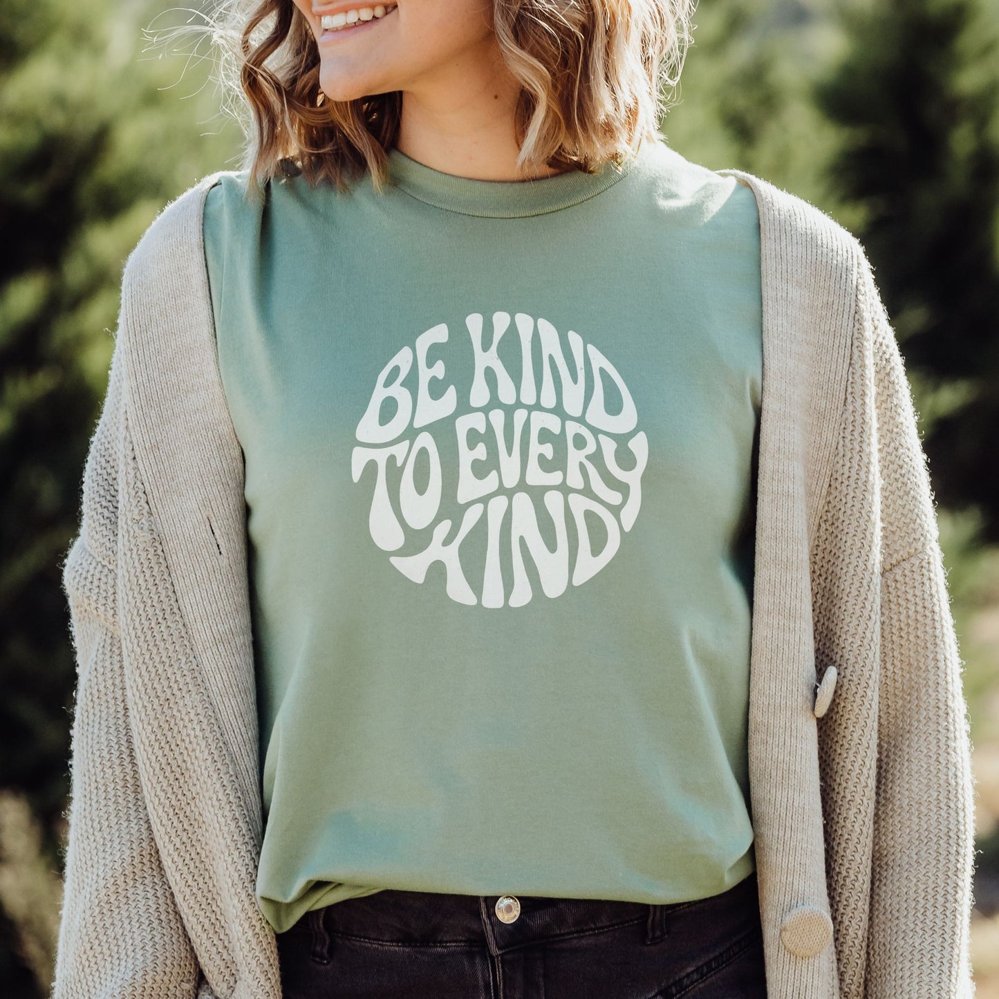 Sage green vegan t-shirt with the slogan Be Kind To Every Kind