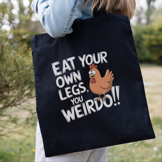 Black vegan tote bag with the funny slogan 'eat your own legs, you weirdo!' and a shocked chicken!