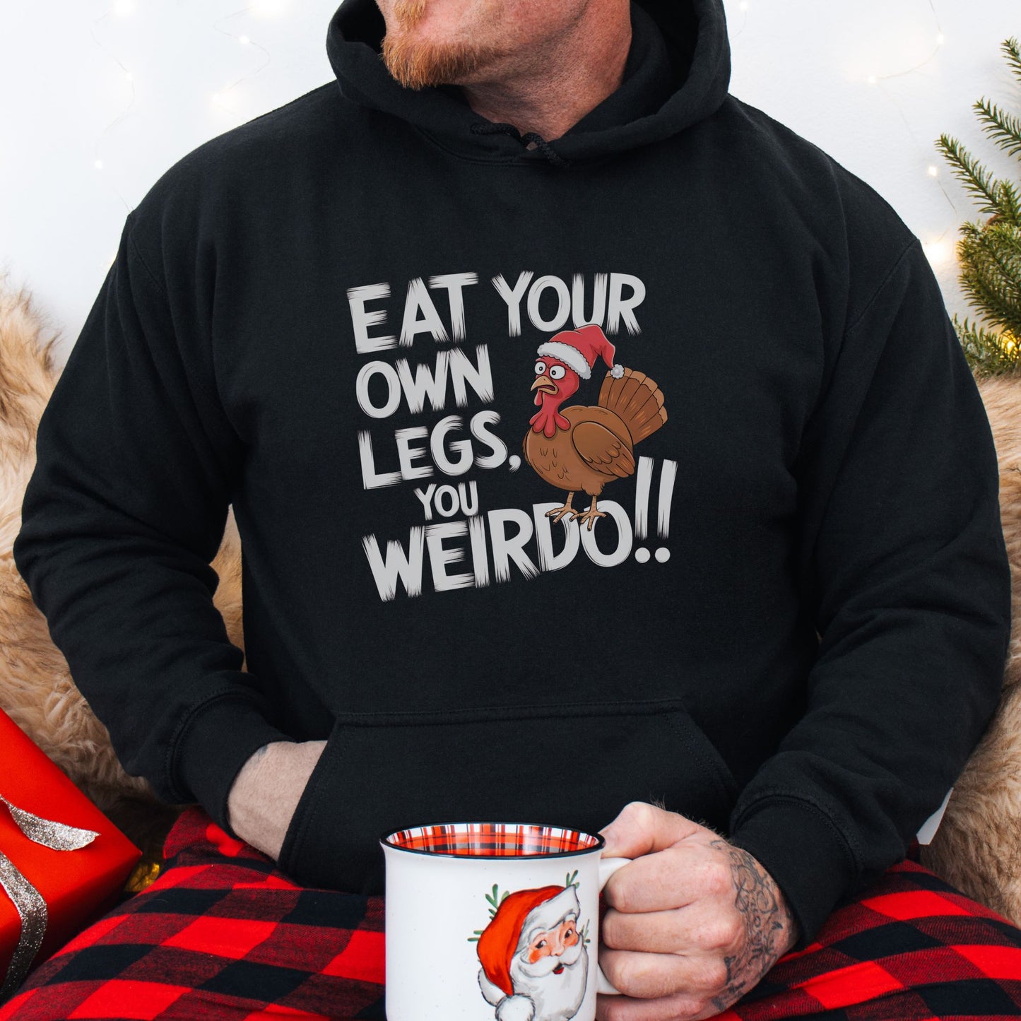 Funny vegan Christmas jumper with a turkey wearing a Christmas hat, and the slogan 'eat your own legs, you weirdo!'