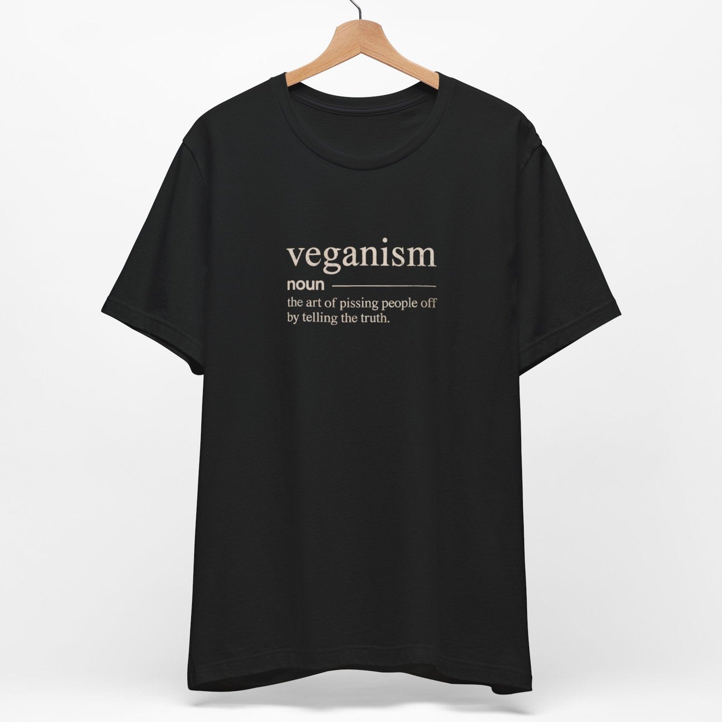 A funny vegan t-shirt with a dictionary definition of veganism. the definition is 'the art of pissing people off by telling the truth'
