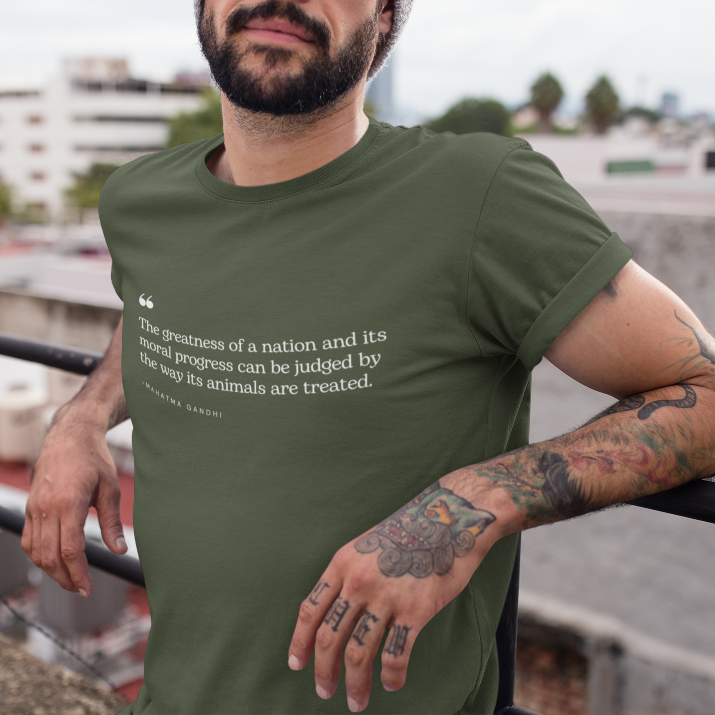 Khaki green t shirt with a quote from Gandhi saying 'the greatness of a nation and its moral progress can be judged by the way its animals are treated'. Perfect for vegetarians, vegans and animal rights activists.