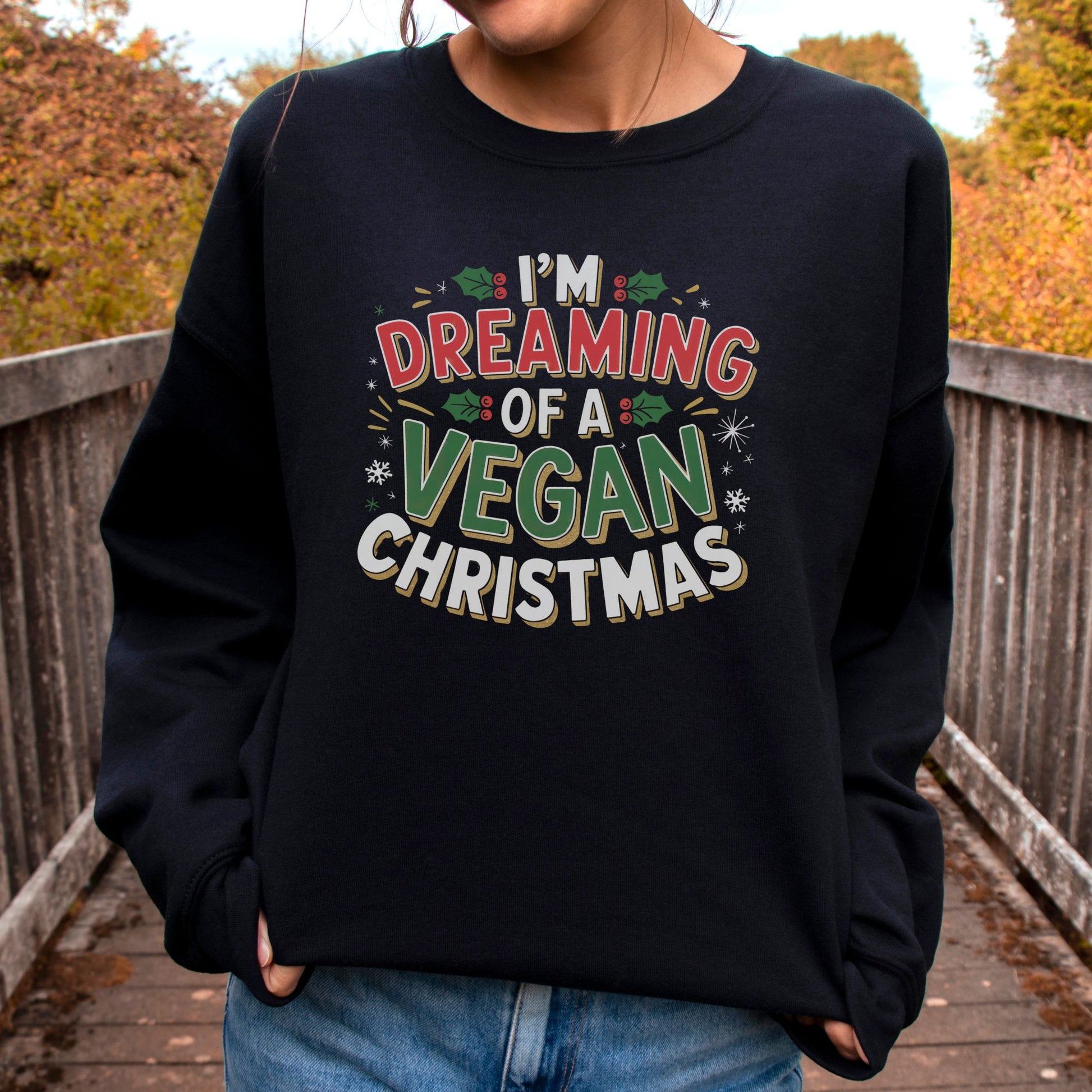 Black vegan sweatshirt with Christmas design and the slogan 'i'm dreaming of a vegan christmas'