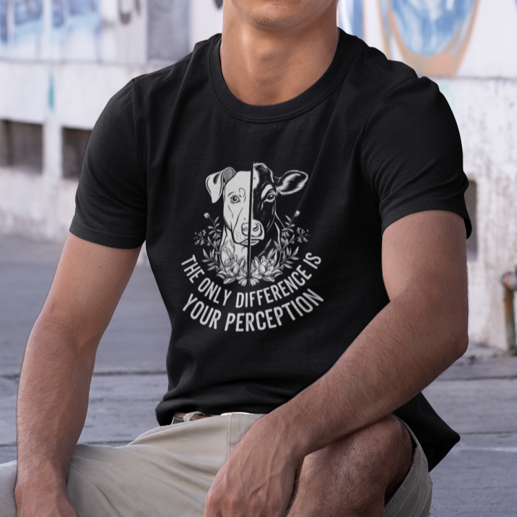 Black t-shirt with the slogan 'the only difference is your perception' and a graphic of half a dog's face and half a cow's face. It is for vegans and animal rights activists.